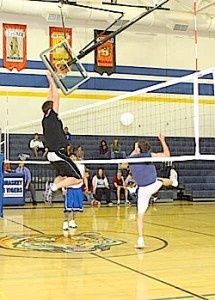 Photo by Terry MillsJunior Wade Detillian, on left, and Brandon Wahl and Josh McDaniel on the right during the juniors vs. seniors Macho Man Volleyball match on Wednesday, Nov. 12.
