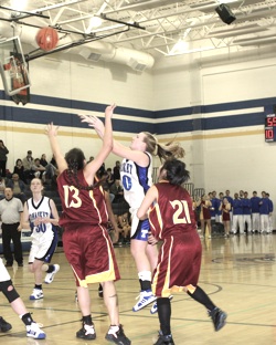 Photo by Terry MillsTonasket's Jessica Kitterman shoots the ball in the Tigers' game against Lake Roosevelt on Tuesday, Jan. 13. The Tigers won with 3.8 seconds left 61-60. Also shown are Moyatat Bell-Bart and Tiffany Adkins from Lake Roosevelt and Dana P
