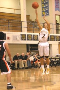 Marcus Kinman, a senior for the Hornets, had 16 points against the Bridgeport Mustangs, including four three-pointers. Photos by Gary DeVon