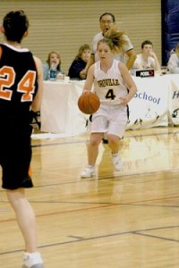 The Lady Hornet's Kayla McKinney brings the ball down court against the Entiat Tigers. McKinney, a 5'5" junior places in the guard position and is one of the Hornet's best ball handlers.