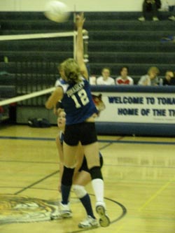 Tonasket freshman Devan Utt jumps up to hit the ball over the net during Tonasket’s home game against Cascade on Tuesday, Oct. 6. Tonasket lost in three sets of 25-17, 25-13 and 25-17. Also shown is junior Jessica Rhoads.Photo by Emily Hanson