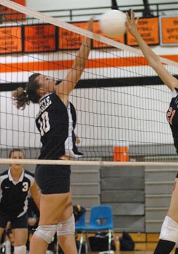Oroville's Rebekkah McCoy, a junior, goes up for a block against Bridgeport in a match Tuesday, Oct. 6 on the Mustang's home court. Although the Lady Hornets lost, their coach described tit as one of the best games played all season. Photo by John Clevela