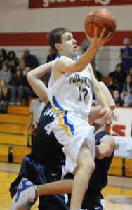 Tonasket sophomore Damon Halvorsen makes a layup shot against Cascade Christian during the Tigers first game at the Brewster Tournament on Tuesday, Dec. 29. Photo by John Cleveland, II