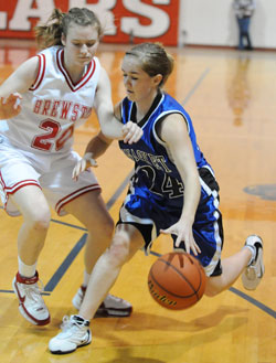 Tonasket junior Karen Keeton dribbles the ball down court while holding off a Brewster defender during Tonasket’s game in Brewster on Friday, Jan. 22. Photo by John F. Cleveland, II