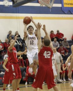 Tonasket senior Wade DeTillian flies toward the hoop to make a shot against Cascade during Tonasket’s home game on Saturday, Feb. 6. Photo by Terry Mills