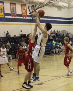 Tonasket senior Wade DeTillian makes a jump shot against Omak during the Tigers’ last home game of the season on Tuesday, Feb. 9. Photo by Terry Mills
