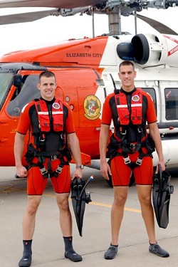 Darren Hicks (right) and a fellow Coast Guard Rescue Swimmer. File photo