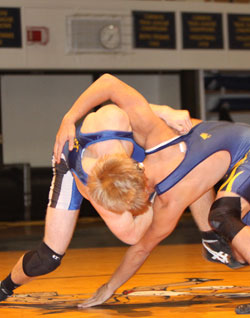 Tonasket’s Lee Leavell gets Oroville’s Nick Perez into a headlock as he works to throw him down to the mat during Tonasket’s match in Oroville on Wednesday, Dec. 8. Leavell won this match-up 5-4. Photo by Terry Mills
