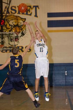 Damon Halvorsen drills his seventh 3-pointer late in Saturday's 77-67 victory over Oroville.