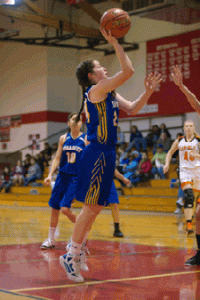 Photos by Brent Baker - Baylie Tyus goes up for two of her 17 points during Tonasket's overtime loss to Republic.
