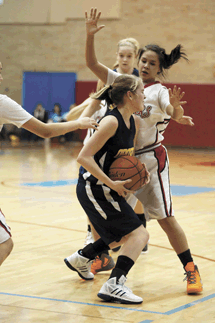 Photo by Brent BakerWhite Swan's physical defense gave Briana Moralez (1) and the Hornets fits early on, but Oroville adjusted to the Cougars' style of play and were only outscored by nine points in the final three quarters of Monday's loss.