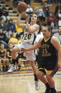 Photo by Brent Baker - The Hornets' Sierra Speiker cuts past Lake Roosevelt's Briana Monaghan on the way to the basket during Wednesday's season-ending loss to the Raiders.