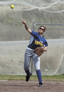 Amber Monroe fires a throw from shortstop during Saturday's doubleheader with Omak.