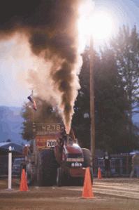 T.J. Tjoelker's "Runnin' in the Red" throws off plenty of heat at Saturday's Truck and Tractor Pulls.