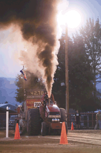 T.J. Tjoelker's "Runnin' in the Red" throws off plenty of heat at Saturday's Truck and Tractor Pulls.