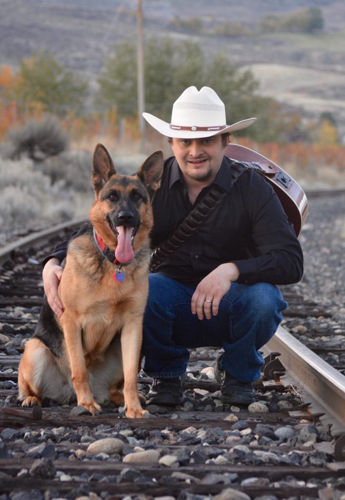 Tonasket musician Brock Hires and his dog Gypsy. Hires has just released a new album, Longneck Bottles, Loud Jukebox.
Submitted photo