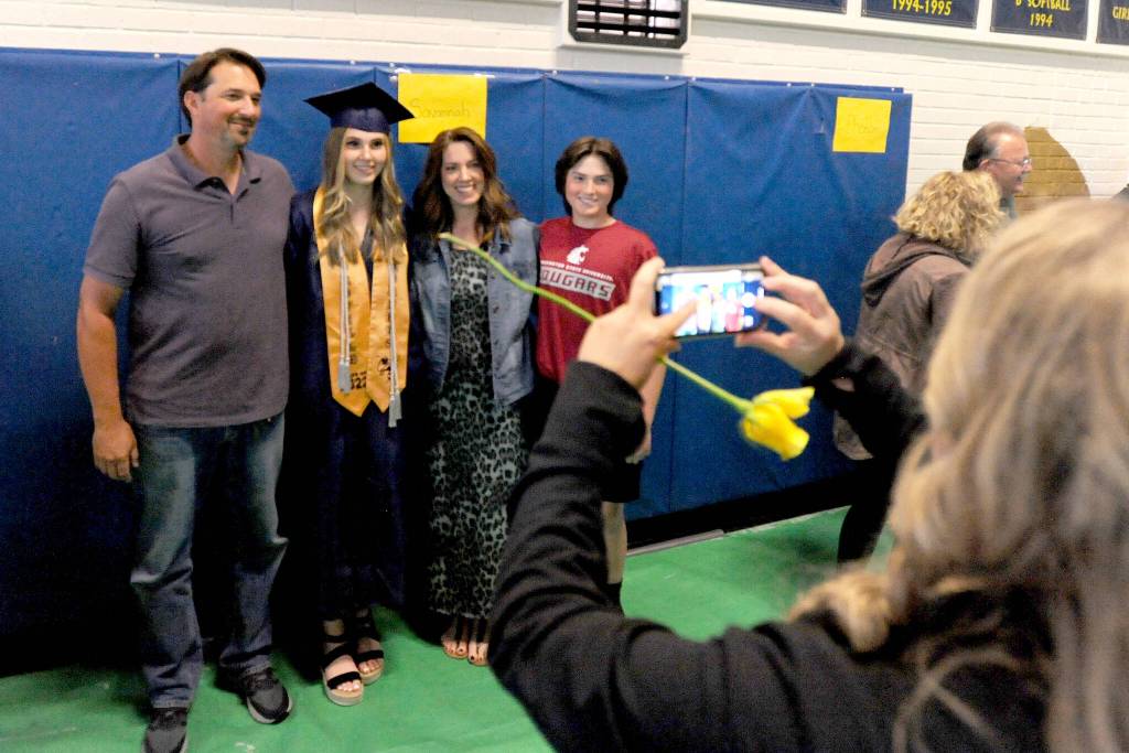 Savannah Berg and family pose for post-grad photos.