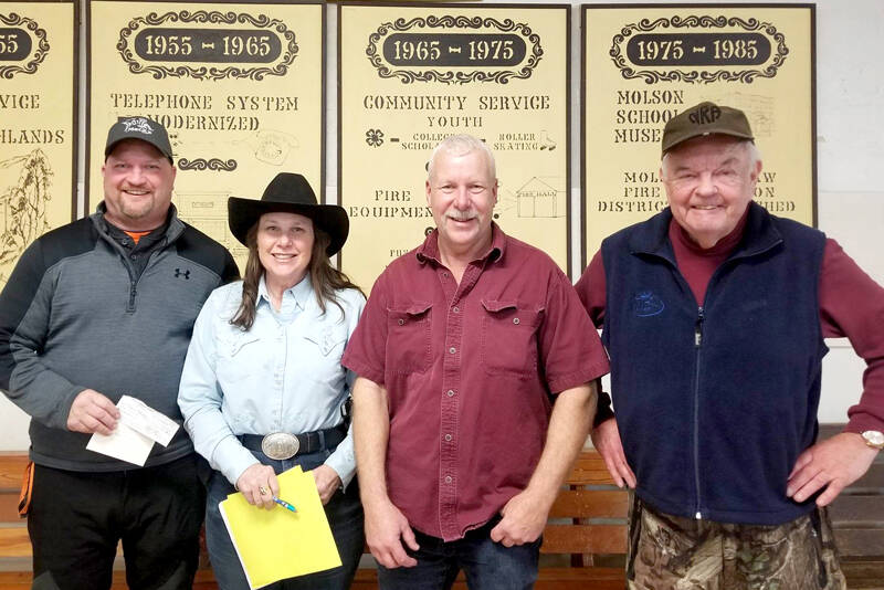 Chris Marcolin, left, took first place in the adult division of the Northwest Ice Fishing Festival held at Sidley Lake last Saturday. Earning second place was Dick Larson, right, who was also the winner of oldest fisherman. Also pictured Robin Stice, who was instrumental in getting the ice fishing derby started 19 years ago and Oroville Chamber President Rocky DeVon who said the derby was a great success.
Angela Larson/staff photo