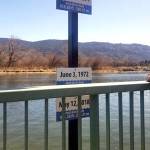 Signs at Oroville's Osoyoos Lake Veterans Memorial Park show floodwater high water marks for 1894, 1972 and 2018.