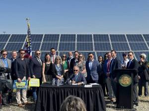 Gov. Jay Inslee, legislators, and clean energy advocates celebrate the signing of seven bills strengthening Washingtons implementation of clean energy policies. Image courtesy of Gov. Inslees Medium page