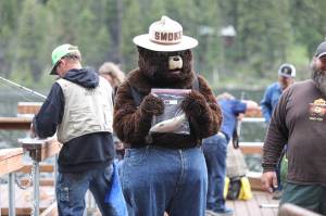 Smokey Bear catches a fish during the 2023 Bonaparte Lake Resort free fishing day festivities on Saturday, June 10. <em>Laura Knowlton/staff photos</em>