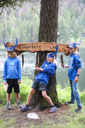 Young anglers, (left to right) Andrew Weddle, Lane Kester, and Logan Kester, size up their catch for the day. The trio spent Saturday morning with their families and other anglers, during the annual event.