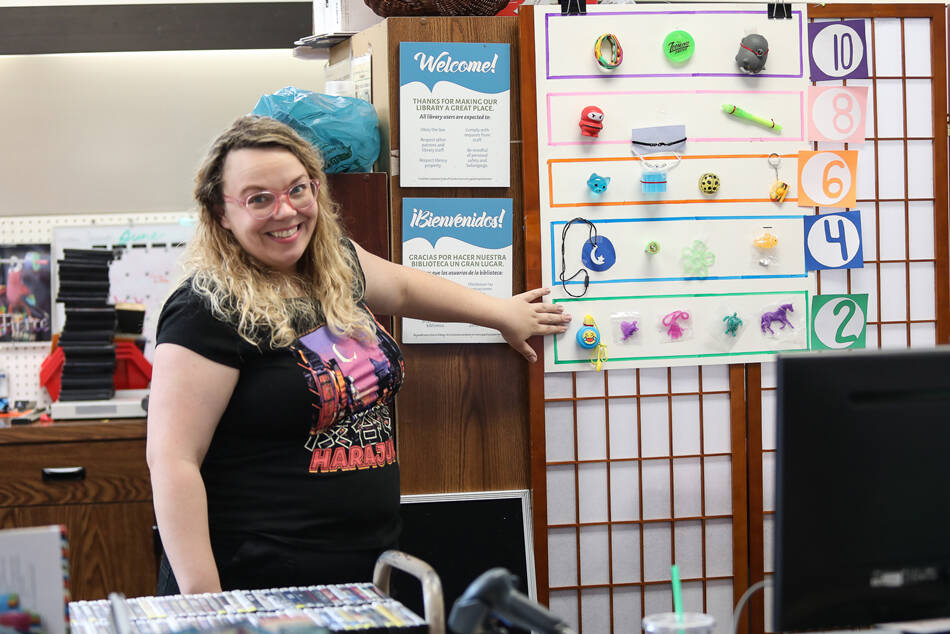 Tonasket librarian Sara Dunn invites readers of all ages to come check out the different summer crafting and reading activities held at the library. She said there is something for everyone and back by popular demand is the Guessing Jar. Summer readers can take a guess at how many starbursts are in the jar and win a prize. Laura Knowlton/staff photo
