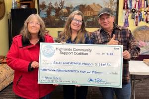The Highlands Community Support Council (HCSC) donated enough money to rebuild an aerator to replace the one at Sidley Lake. Laura Robinson, HCSC Treasurer, Anne Alden, HCSC Secretary and Kevin Myrick, HCSC board member and volunteer with a check representing the donation. HCSC/submitted photo