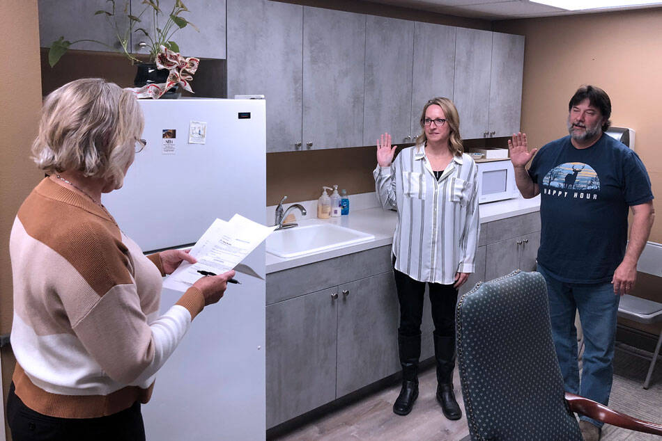Newly elected North Valley Hospital District board member Stephanie Steiman and reelected board member Jerry Bradley, are administered the oath of office at the boards Thursday, Dec. 21 meeting. Steinman will serve in District 5, At-Large.. Bradley returns as the representative for Disrtrict 2. Gary De Von/staff photos