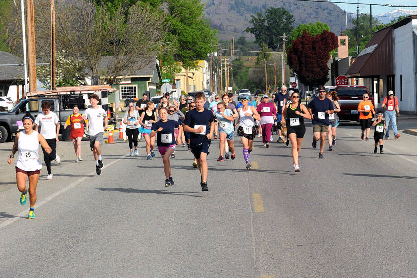 Gary DeVon/staff photos
Runners in the 42nd Annual May Festival Fun Run blast down Appleway for the start of the race. Runners, and walkers, participated in either a 5K or two-mile race.