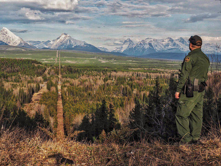 A Border Patrol agent standing watch at the Montana-Canada border in the CBP Spokane Sector. The Spokane Sector covers the U.S.-Canada border along the northwestern section of Montana, part of Idaho, and the eastern part of Washington. <em>U.S. Customs and Border Protection photo</em>