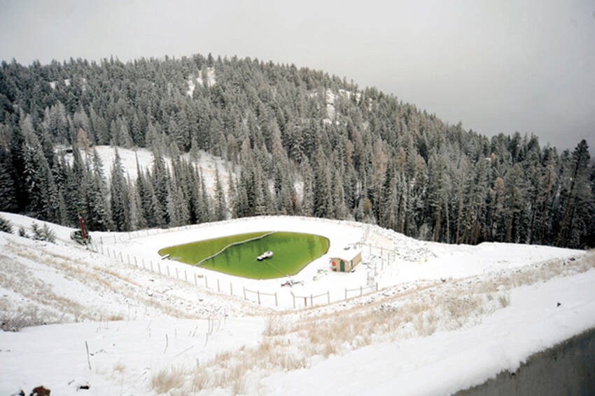 Groundwater and snowmelt in settling pond where water was collected prior to treatment at the Buckhorn Mine near Chesaw. Photo taken during a tour of the mine before it was closed and went into the reclamation phase. <em>Gary DeVon/G-T file photo</em>