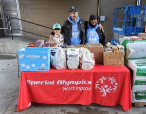 The Okanogan County Sasquatch organized a food drive to support local food banks. They were hosted by Lee Franks and Grants Market from 9 a.m. to 2 p.m. last Saturday, Nov. 2. Pictured with the generous donations of the Tonasket community are (l-r) Charlie Tonasket, Jason Utecht and Enrique Pio.  Submitted photo