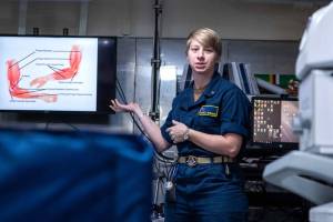 Lt. Alexa Werner, from Oroville, Washington, the ships physical therapist aboard Nimitz-class aircraft carrier USS George Washington (CVN 73), displays a muscle diagram during a sick call evaluation training in main medical while underway in the Philippine Sea, Nov. 20, 2024. George Washington is 7th Fleets premier forward-deployed aircraft carrier, a long-standing symbol of the United States commitment to maintaining a free and open Indo-Pacific region, while operating alongside Allies and partners across the U.S. Navys largest numbered fleet. (U.S. Navy photo by Mass Communication Specialist 3rd Class Johnathan M. Meighan)