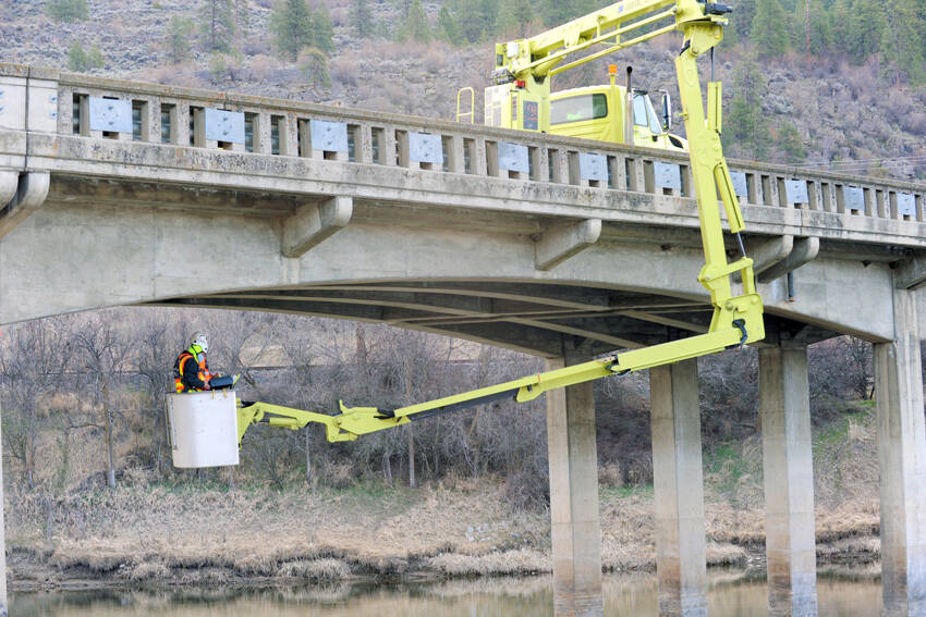 The Washington State Department of Transportation inspects the SR97 bridge over the Okanogan River south of Oroville in April of 2021. Gary De Von/GT File Photo