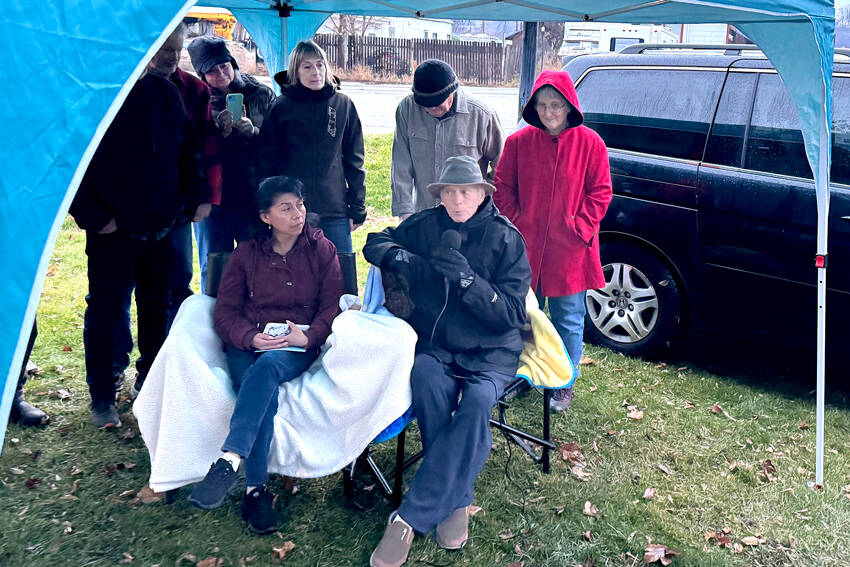 Jeff and Elia Bunnell watch as the new sign naming Orovilles Triangle Park as Jeff Bunnell Park last Saturday. There were many kind words spoken about Bunnell, who started the Oroville Initiative (TOI) and has volunteered many hours trying to improve Oroville. The former Triangle Park is the project he says he is most proud of.. Gary DeVon/staff photos