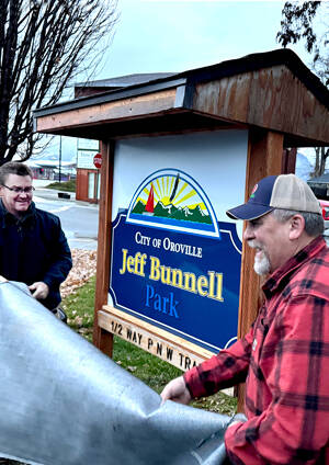 TOI board member Wes Torzeski and Oroville Public Works Superintendent Steve Thompson unveiled the new sign dedicating Triangle Park as Jeff Bunnell Park at last Saturdays dedication ceremony.
