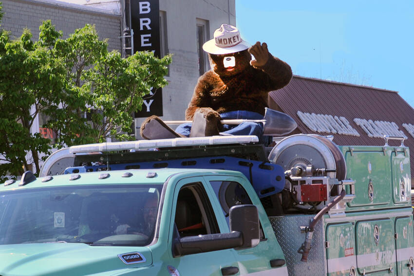 Smokey Bear rides on top of a U.S. Forest Service (USFS) truck in the May Festival Parade. Smokey is a familiar sight at May Fest as well as events around the country and his Only You Can Prevent Forest Fires is familiar to nearly every school-age child in the nation. The Department of Natural Resources (DNR) has teamed up with none other than the iconic Smokey Bear. The DNR has received funding from the USFS to wrap 10 trailers with Smokeys image, as well as fire prevention information and resources. Gary DeVon/GT file photo