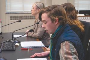 Sebastian Ford (front), a Bainbridge resident and a high school student, shares his testimony during a public hearing for HB 1631 on Feb. 4. Ford is one of the people who spearheaded the drafting of the bill. Photo by Juan Jocom