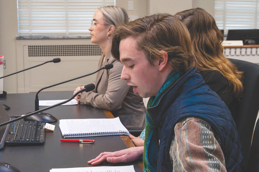 Sebastian Ford (front), a Bainbridge resident and a high school student, shares his testimony during a public hearing for HB 1631 on Feb. 4. Ford is one of the people who spearheaded the drafting of the bill. Photo by Juan Jocom