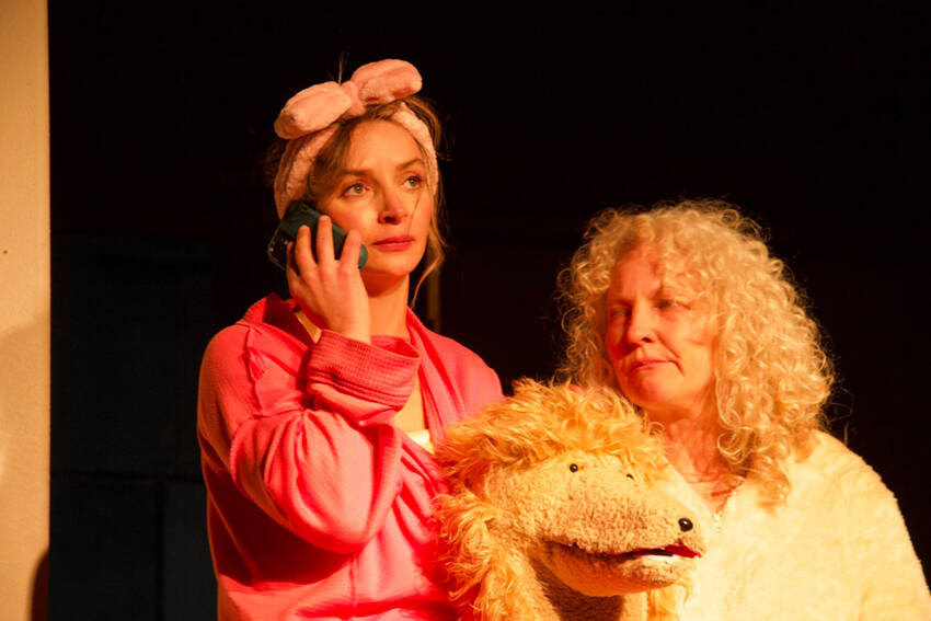Danika Smith in the lead role as Diedra in The Pack, a new theater production showing at the Tonasket Community Cultural Center. She is seen here with Julie Alley, who plays the new poodle puppy Maxi. Rob Thompson/submitted photos