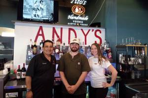 Easton Anderson with some of the staff of Andys Bar & Grill. Angela Larson/staffphoto