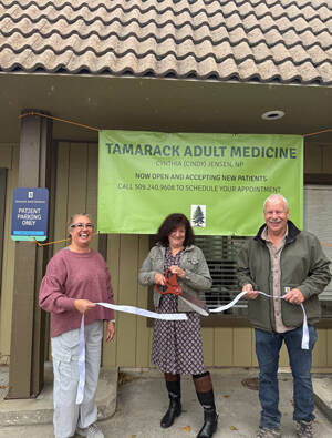 Cindy Jensen cuts the ribbon, opening her new business, Tamarack Adult Medicine. Oroville WA Chamber of Commerce President Rocky DeVon and Oroville Chamber Secretary Shelly Roberts participated in the ribbon-cutting ceremony. OWCoC/Submitted photo