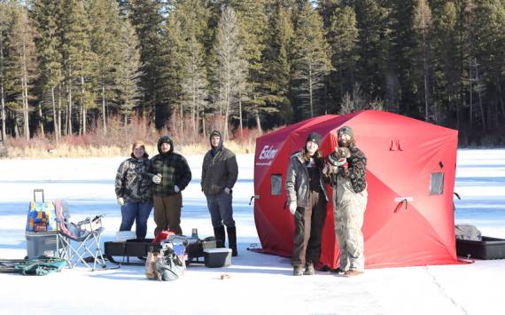 Anglers line the ice at Bonaparte Lake during the 4th Annual Ice Fishing Derby held last Saturday, drawing famillies and competitors out for a day of winter fun. Laura Knowlton/staff photo