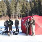 Anglers line the ice at Bonaparte Lake during the 4th Annual Ice Fishing Derby held last Saturday, drawing famillies and competitors out for a day of winter fun. Laura Knowlton/staff photo