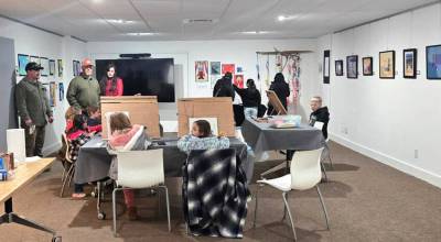 Some young artists try work on art projects while parents and friends take in the art exhibition at the Guild Art Center and Gallery. The exhibit is open to the public Monday through Saturday until March 31. Submitted photo
